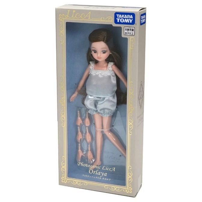  LiccA Orlaya doll in box with extra hands. Brown hair, blue pajamas.