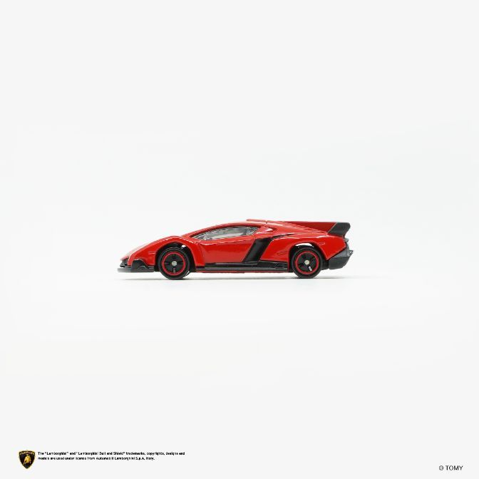  Red toy Lamborghini Veneno with black accents and red wheels on a white background.