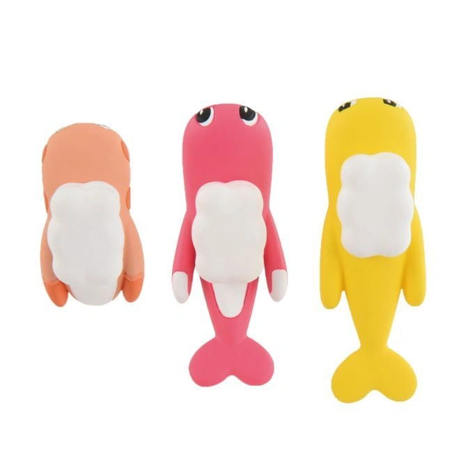  Three colorful dolphin-shaped erasers: orange, pink, and yellow, with white bellies and cartoon eyes.