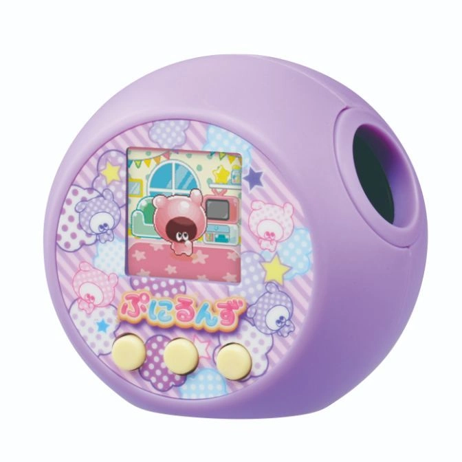 Purple Tamagotchi Uni with a colorful screen showing a cartoon bear in a room.