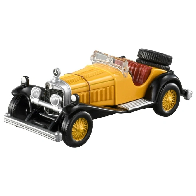 Yellow and black toy Mercedes-Benz roadster with spare tire.