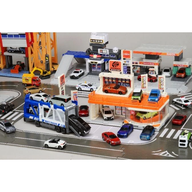  Toy car playset with gas station, police station, construction site, and car carrier truck.