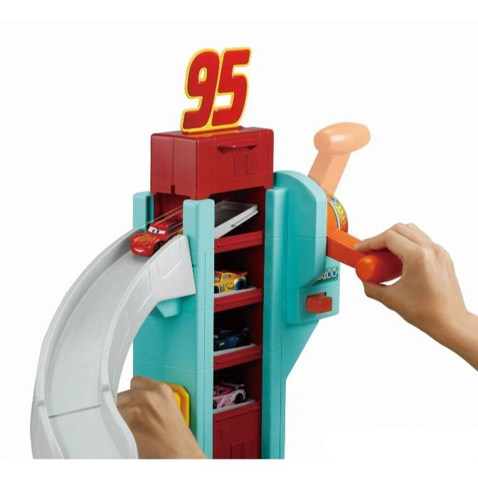  Cars 3 race track toy with hand cranking cars down the ramp.