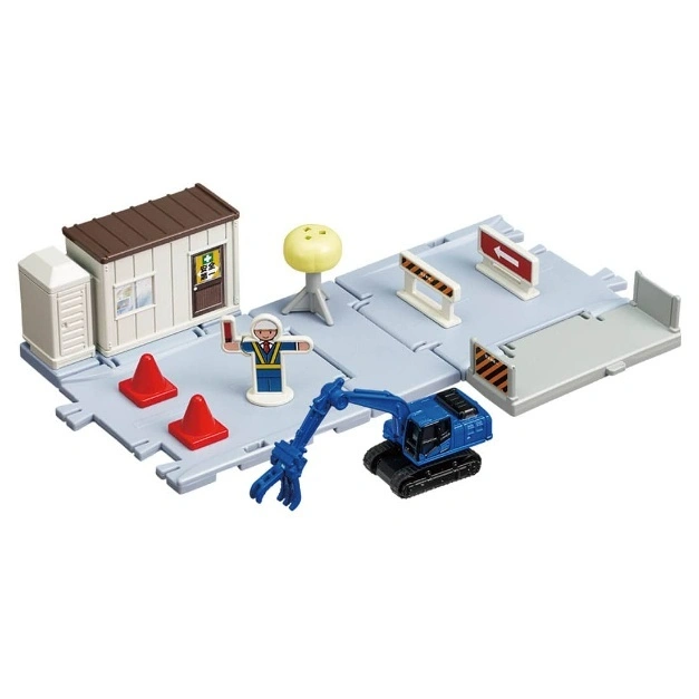  Toy construction site with excavator, cones, worker figure, and site office.
