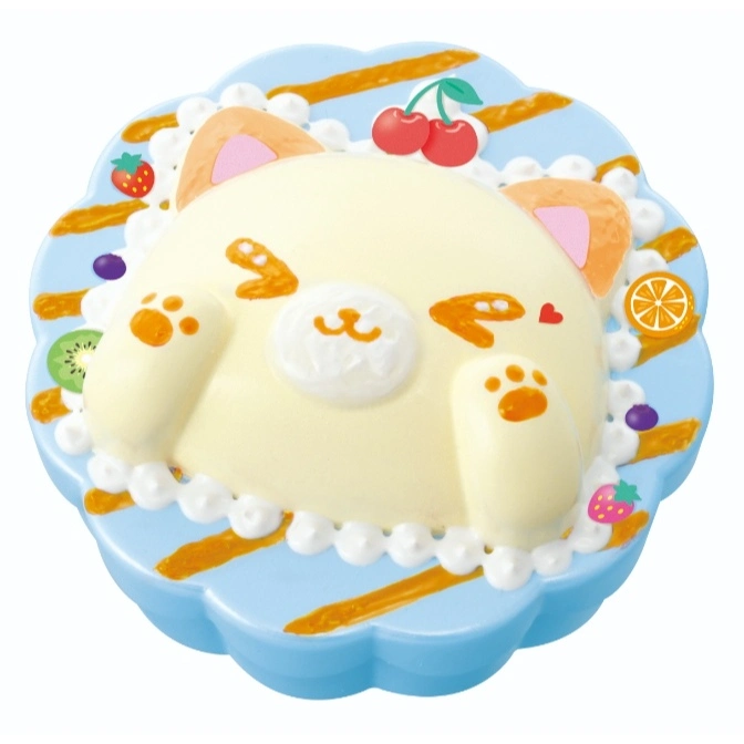Cat-shaped squishy toy with fruit toppings on a blue plate.
