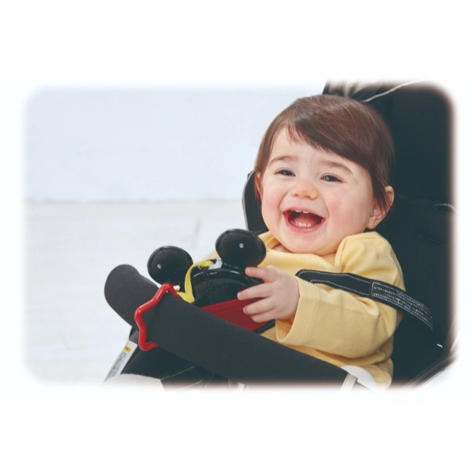  Baby in car seat with Mickey Mouse toy, smiling.
