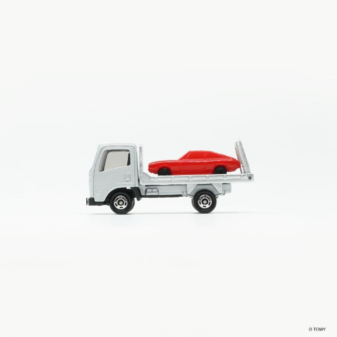  Toy truck carrying a red toy car.