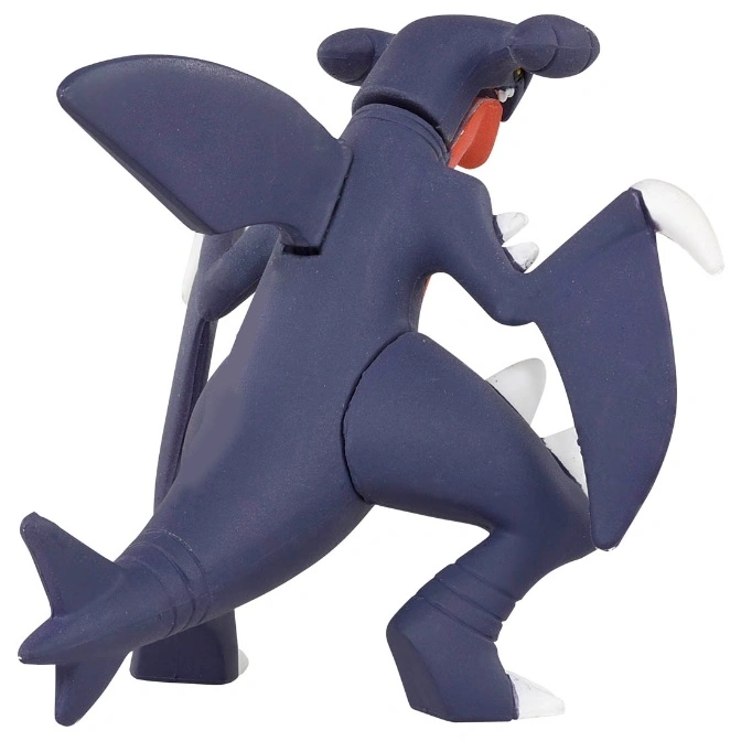  Dark blue Garchomp toy figure with white accents, wings spread.