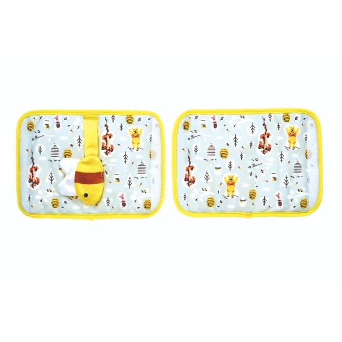  Winnie the Pooh changing pad with yellow trim and Pooh bear toy attached.