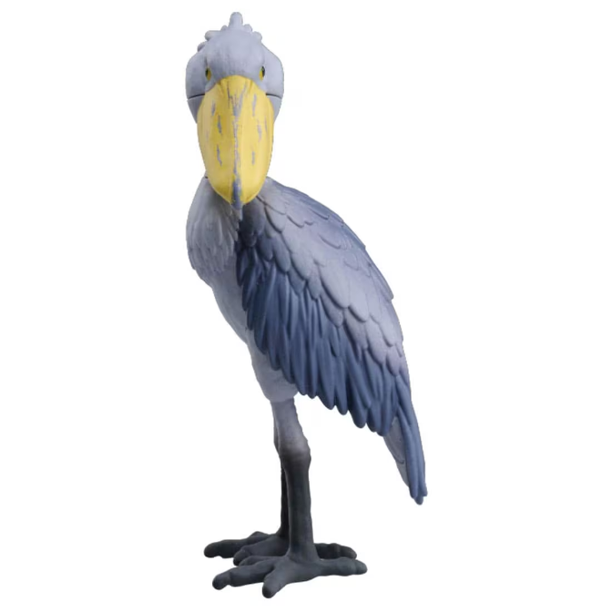 Shoebill stork toy with a large yellow beak and gray feathers, standing on two feet.