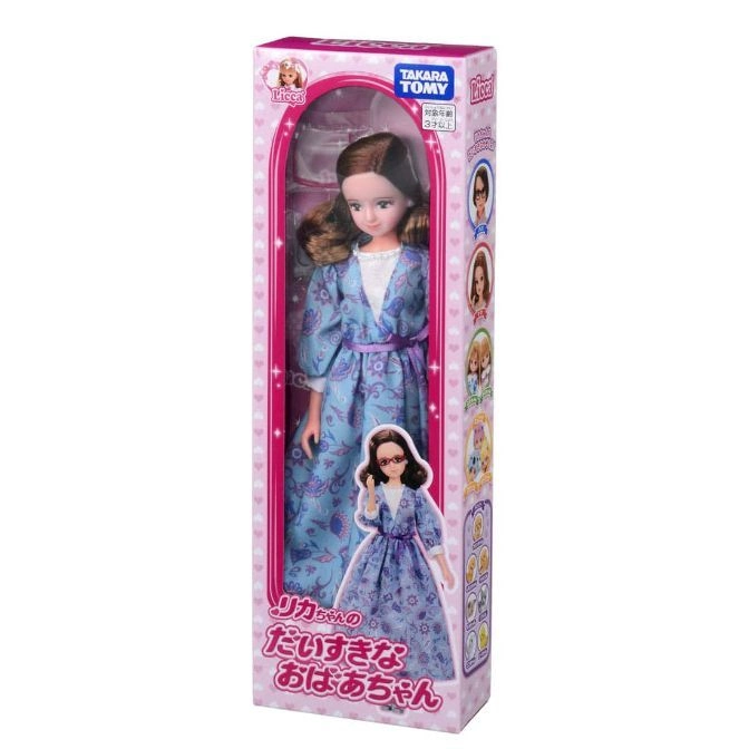  Licca doll in blue floral dress, packaged in a pink box with character images.