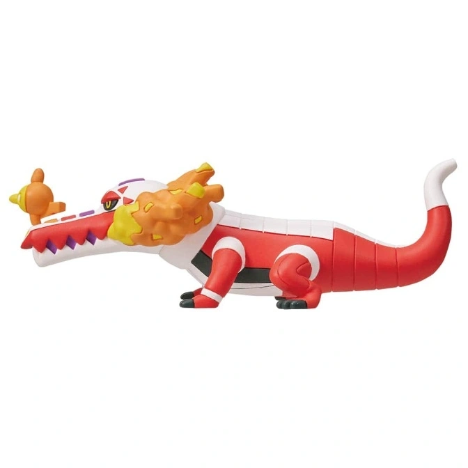  Fuecoco toy figure with a tiny bird on its snout, red body, and white accents.