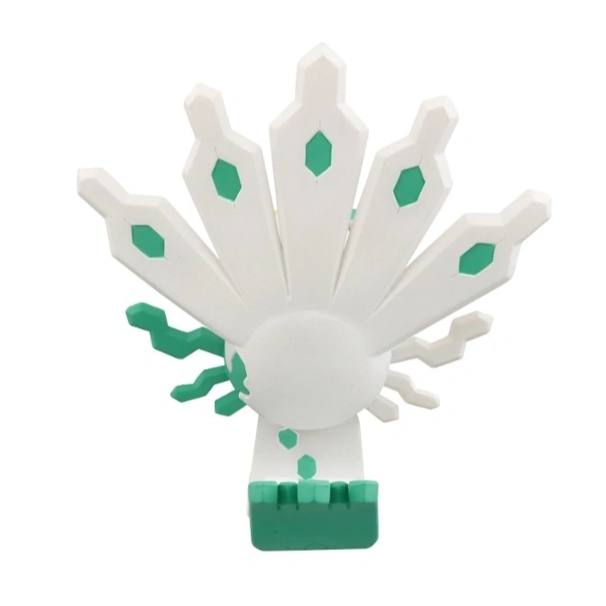  White and green Zygarde Core toy with fan-like extensions and geometric details.