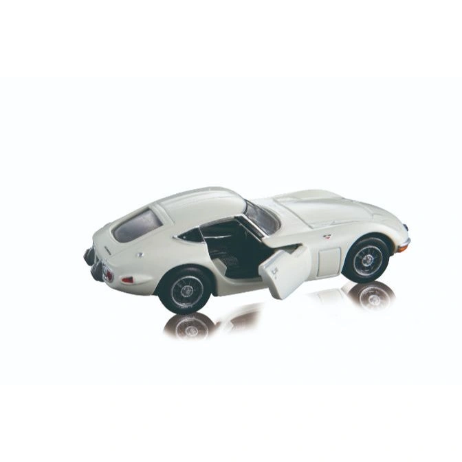  White toy car with open door, reflecting on a white surface.