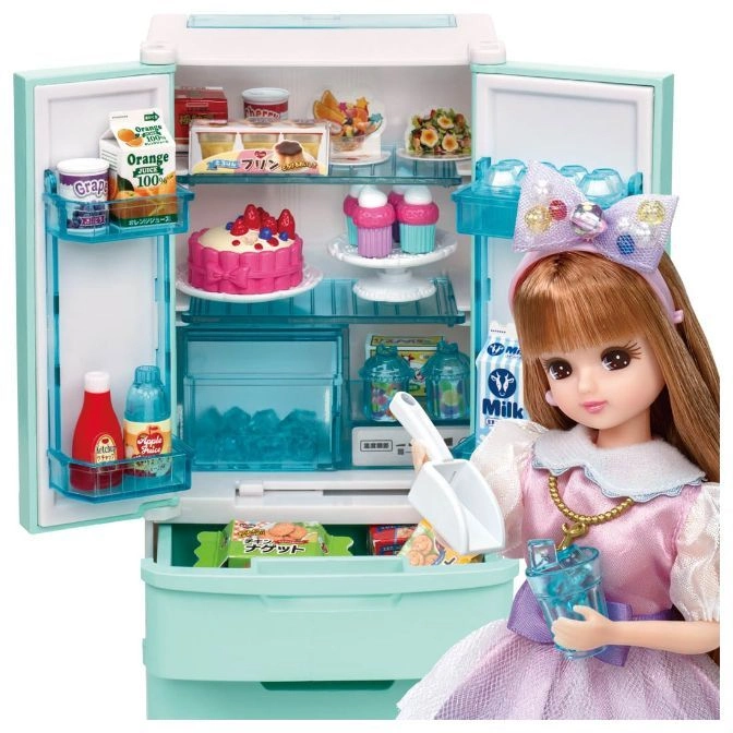 Toy refrigerator with food and doll. The fridge is open, revealing play food items.