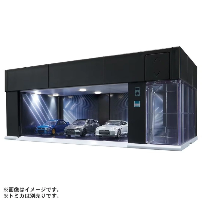 Toy car garage with three model cars inside, featuring LED lighting and a transparent display case.