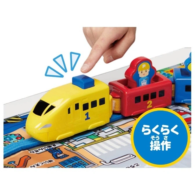  Toy train with yellow engine, red passenger car, and blue caboose on a playmat, finger pressing button.
