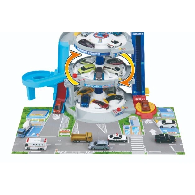  Tomica parking garage toy with cars, elevator, and spiral ramp. Cars are on display and driving on the playmat.