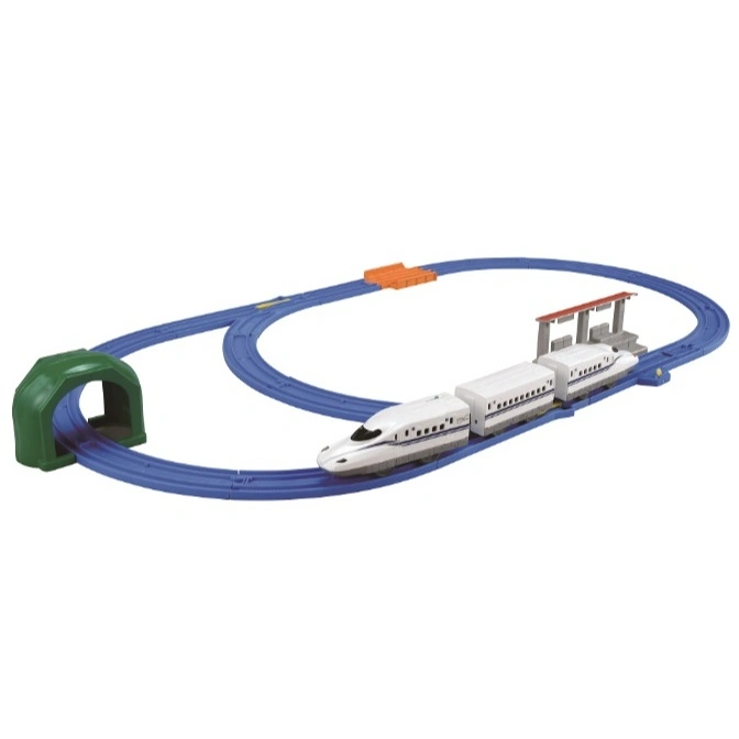 Toy train set with a white bullet train on a blue track, featuring a tunnel and station.