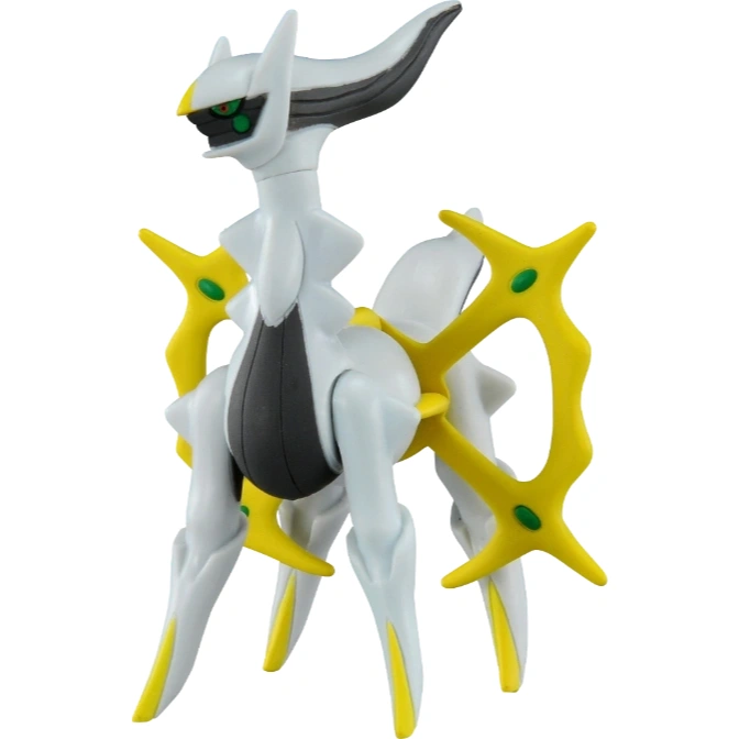 Arceus Pokémon toy figure with yellow cross wheel and green gems.