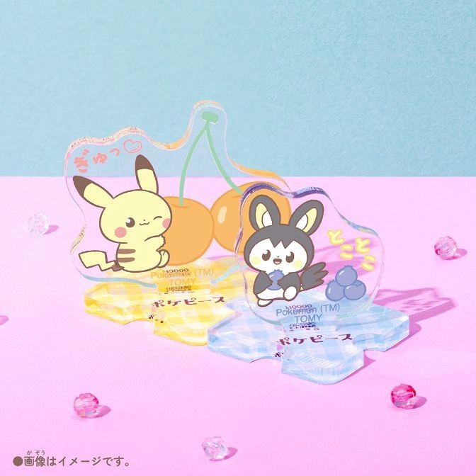  Pokémon cherry-shaped acrylic stands featuring Pikachu and Pawmi on a pink surface.