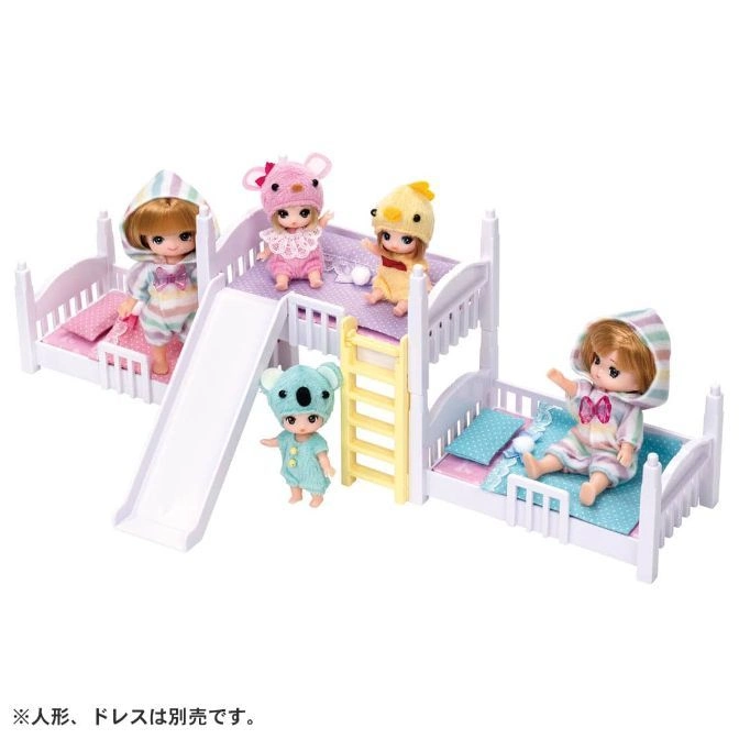  Doll playset with bunk beds, slide, and four dolls wearing animal-themed pajamas.