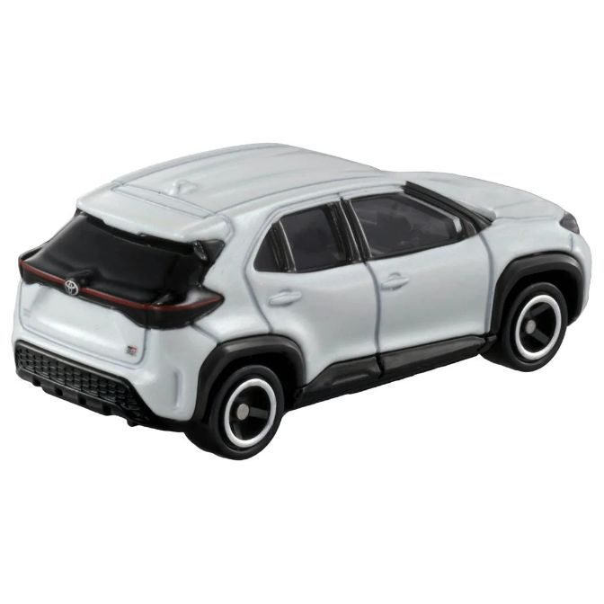  White toy car, a miniature SUV with black trim and wheels.