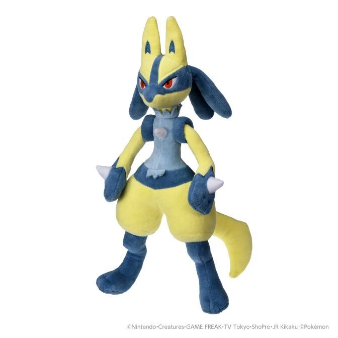 Lucario plush toy standing, featuring blue and yellow coloring with white spikes on its hands.