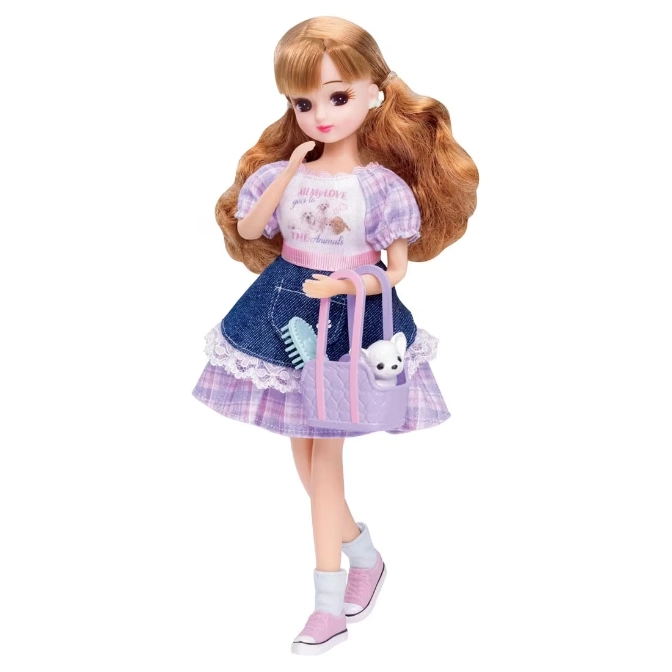 Licca-chan doll in a dress, holding a pet carrier with a dog and brush.