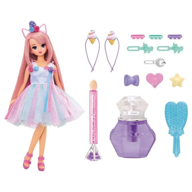 Doll with unicorn headband, dress, and accessories including hair clips, perfume, and a brush.