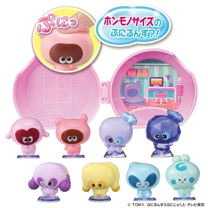 Pink Tamagotchi Uni-like toy with characters. Some are on stands. Open toy shows a room scene.