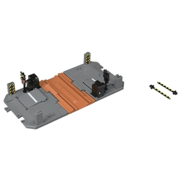  Toy train crossing with signals and striped barriers. A miniature railway playset.