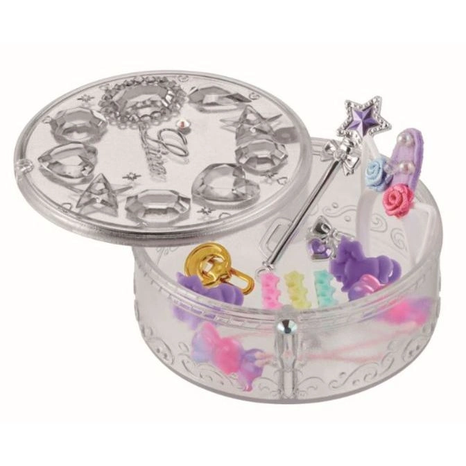  Round toy jewelry box with gems, wand, and accessories. Lid is partially open.