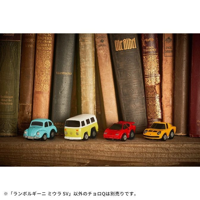  Toy cars: blue Beetle, yellow VW bus, red Lamborghini, yellow Miura, on a shelf with books.