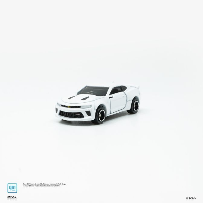  White toy Chevrolet Camaro with black accents, a miniature diecast model car.