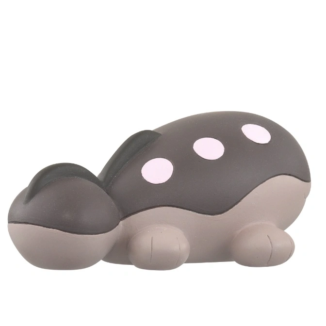  Grey mushroom-shaped toy with pink spots and small legs.