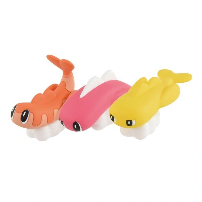Three toy sushi Pokemon figures: orange Crawdaunt, pink Alomomola, and yellow Relicanth.