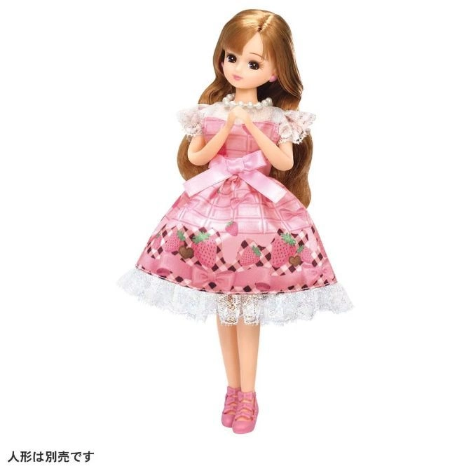  Licca doll in a pink strawberry dress with lace trim and matching shoes.