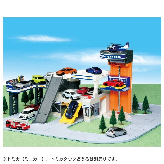 Tomica Play Park toy set with cars, helicopter, parking garage, elevator, and gas station.
