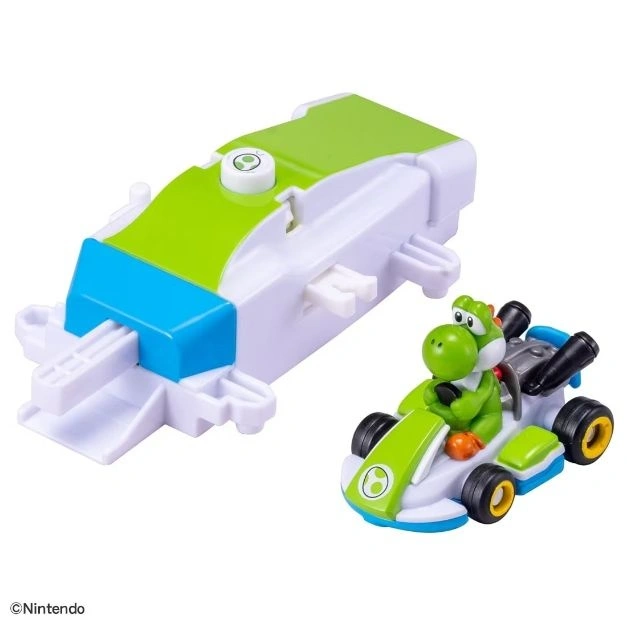Yoshi Mario Kart toy with launcher. Yoshi is in his kart, ready to race.