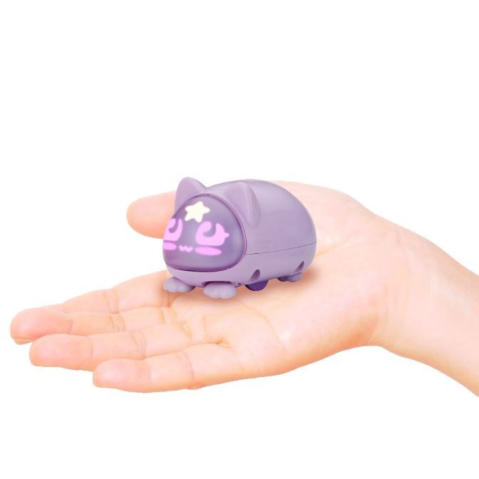 Purple cat-shaped toy robot with a star on its head sitting in a hand.
