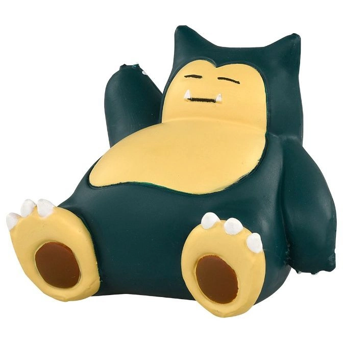 Snorlax figurine reclining with a sleepy expression and visible toes.