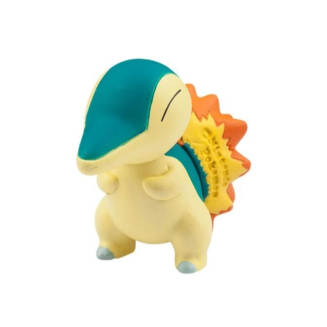 Cyndaquil toy figure with blue head, cream body, and orange flame on its back.