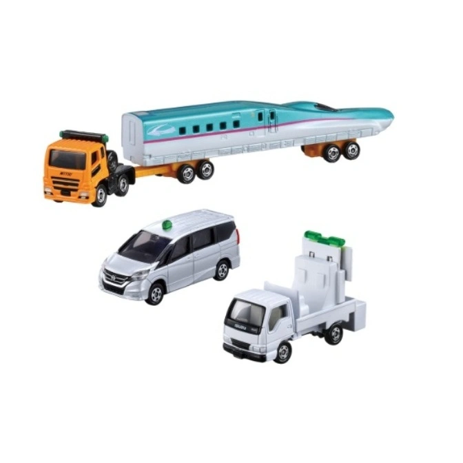 Toy train on truck, silver van with green light, white truck with equipment.