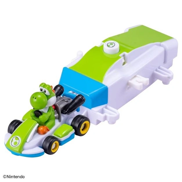  Yoshi in a green and white toy go-kart with a launcher attachment.