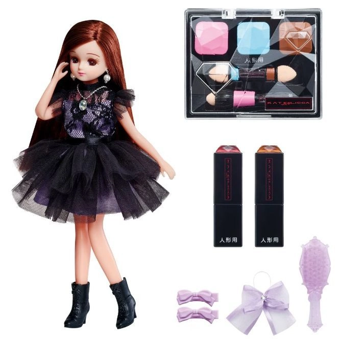  Licca doll in black dress with makeup set, lipsticks, bows, and hairbrush.
