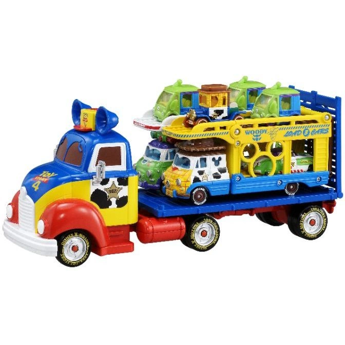  Toy Story Woody's Round-Up truck with character cars on a blue and yellow trailer.