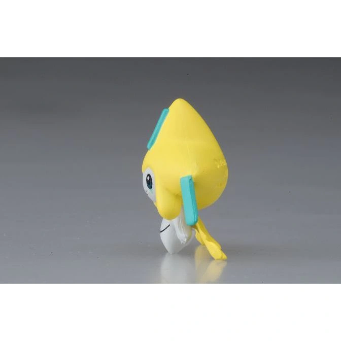  Yellow Jirachi toy with teal accents, side view.