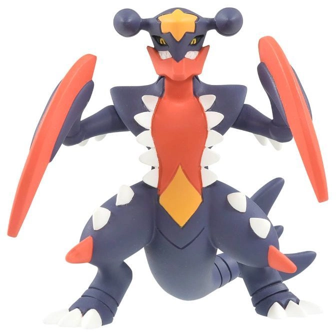  Garchomp toy figure with orange blades, dark blue body, and white spikes.