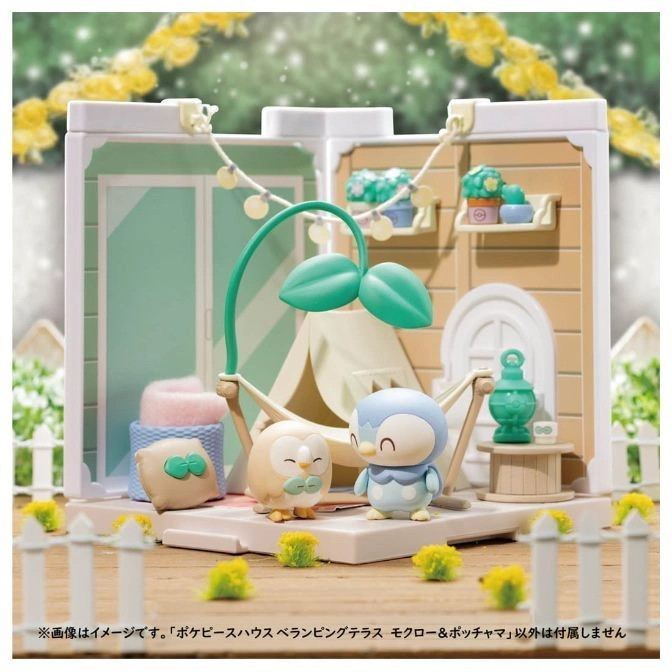  Pokémon terrarium with Rowlet and Piplup figures in a camping scene with a tent and hammock.
